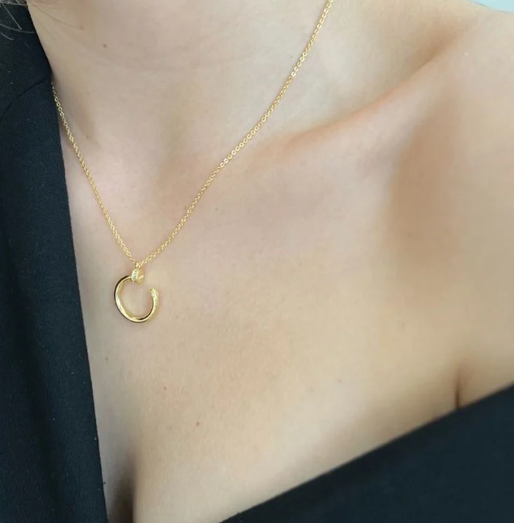 Click to view full screen Gold Harmony – Sculptural Open Loop Necklace with Crystal Detail photo review